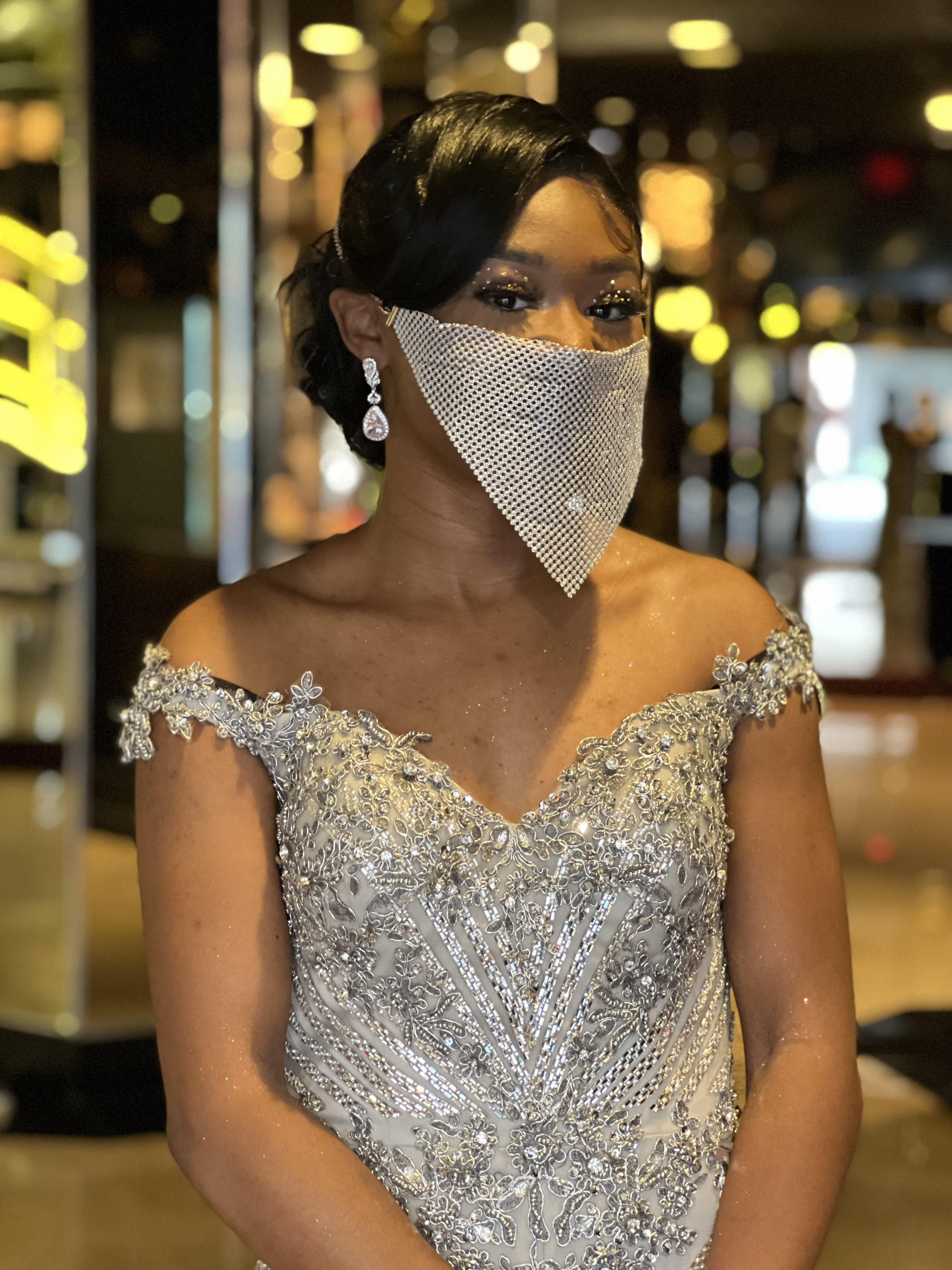EPIC Valedictorian poses with glamorous dress and matching mask at 2022 Senior Prom. 