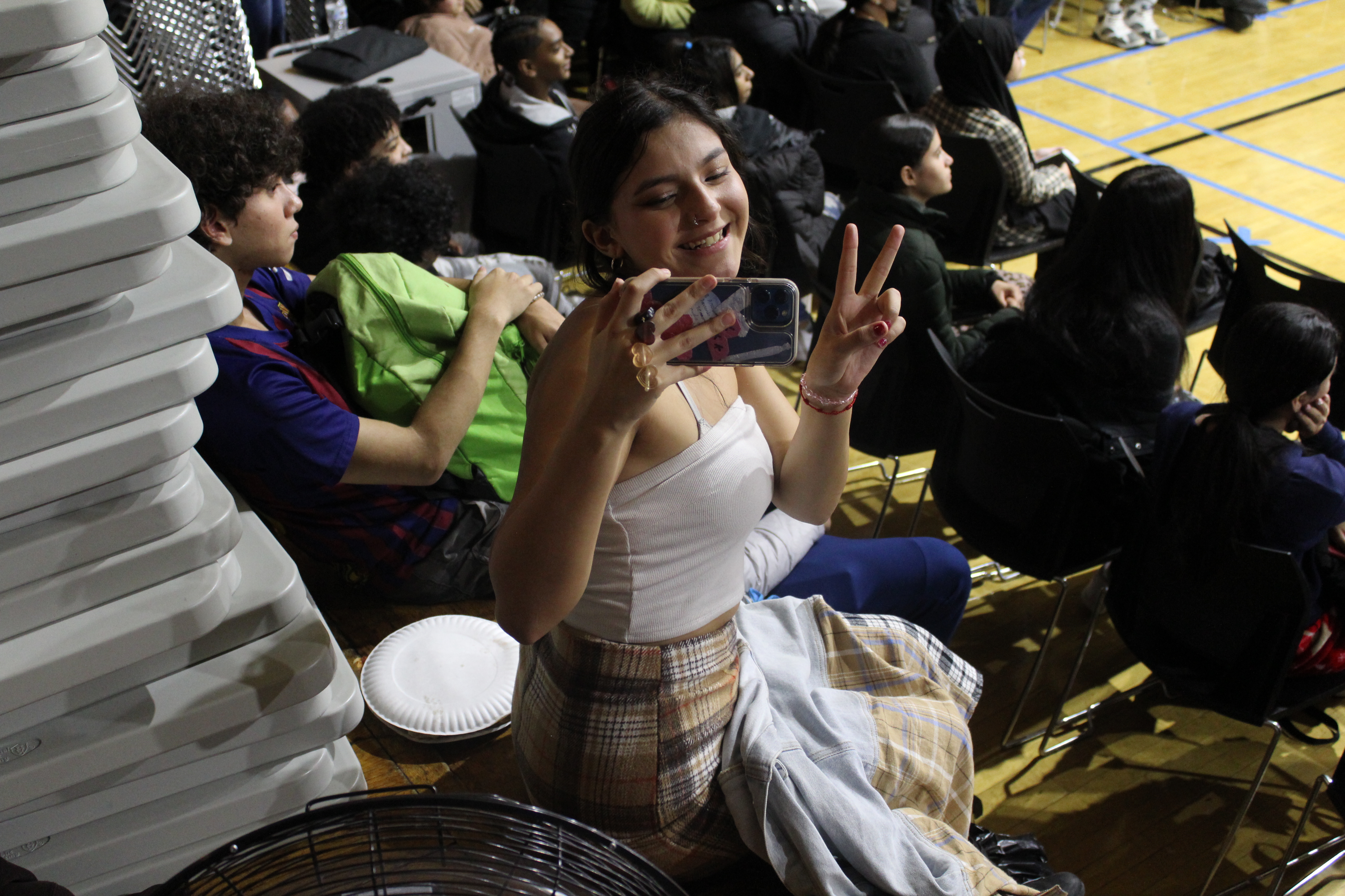 Kat Colon poses as she watches the game